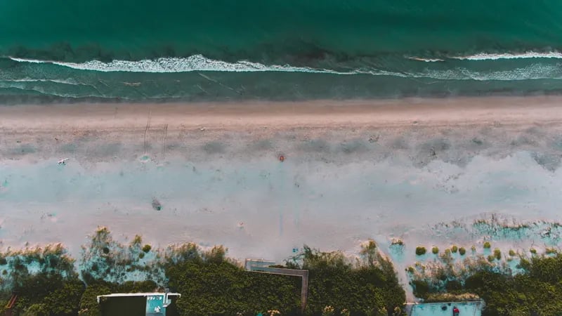 Quiet Florida barrier-island shoreline, the setting for a rarely-listed oceanfront estate